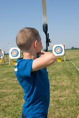 Boy shooting bow