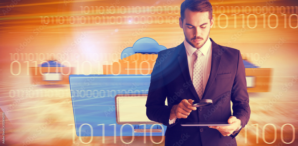 Poster concentrated businessman using magnifying glass against composite image of cloud computing drawer