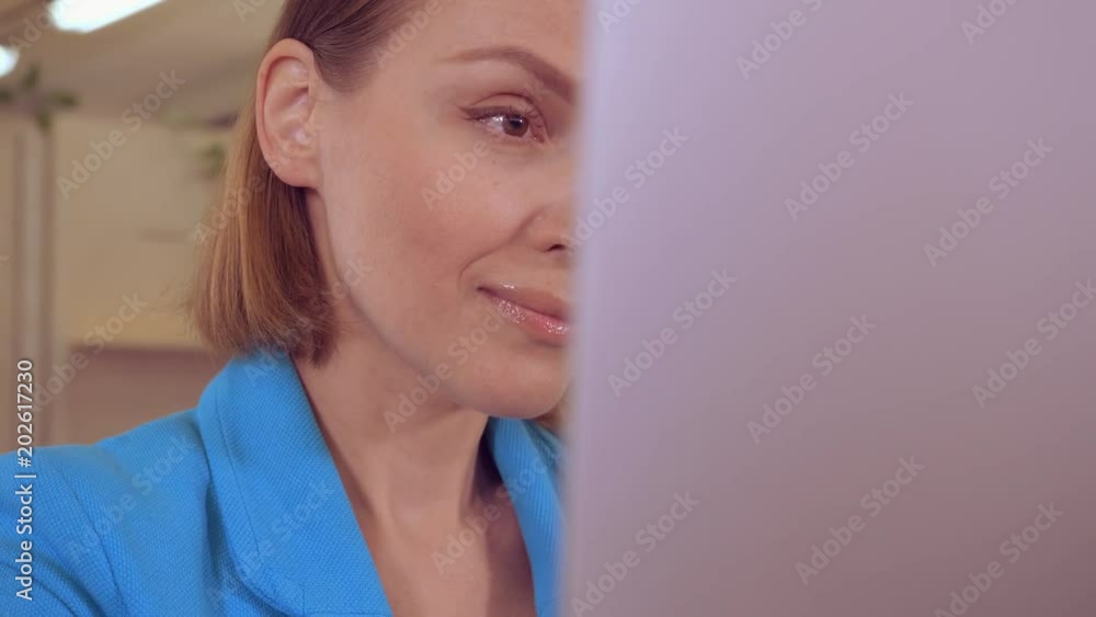 Aufkleber portrait close up face businesswoman with blond hair working in front of computer looking on display