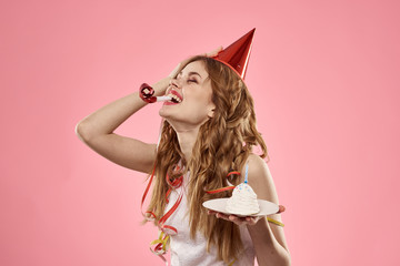 happy woman in red cap holds cake in hand