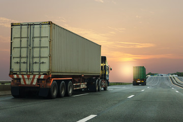 Truck on highway road with container, transportation concept.,import,export logistic industrial Transporting Land transport on the asphalt expressway with sunrise sky