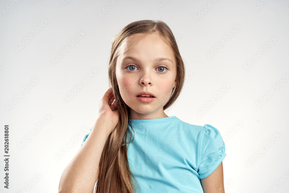 Wall mural surprised girl in blue dress