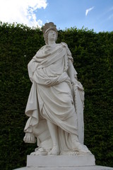 White stone sculpture, symbol of Europe in the summer day i Versailles garden