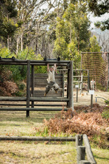 Soldier running through obstacle course