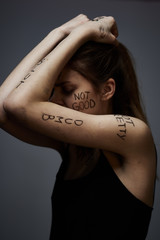 insults bad words on the body woman resentment sadness