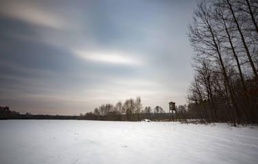 Long exposure winter landscape with raised hide
