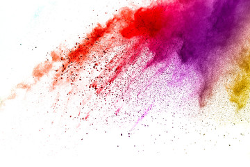 Multi color powder explosion isolated on white background. Color dust splash cloud on white background. Launched colorful particles on background.