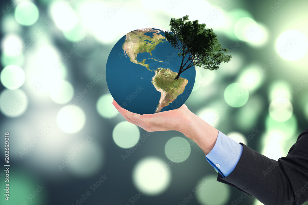 Poster close up of businessman with empty hand open against light circles on green background