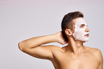 man in white mask for face skin care