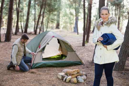 Young couple with tent in the wilderness - Powered by Adobe