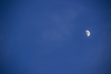 Naklejka na ściany i meble blue sky glow moon in the right center of the frame