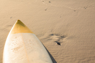 High angle view of surfboard on sand at beach