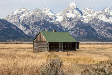 A barn on Mormon Row in Grand Teton National Park. In the background are the beautiful mountains of Wyoming, USA.