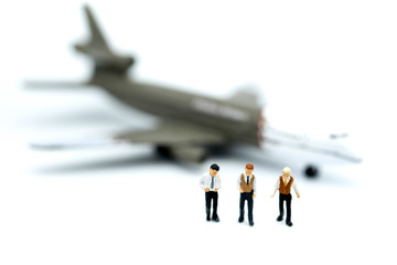 Miniature people : young business with  air plane using for business trip concept.