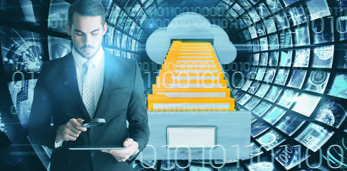 Concentrated businessman using magnifying glass against composite image of cloud computing drawer