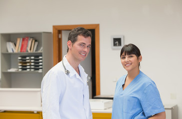 Doctor and a nurse smiling