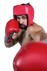 Muscular man boxing in gloves