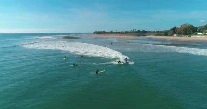 Aerial footage of people who are surfing. Surfers, students. Malibu Beach. California. May 2018. 4K slow motion video. Drone.
