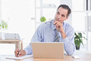 Thinking businessman on his office 