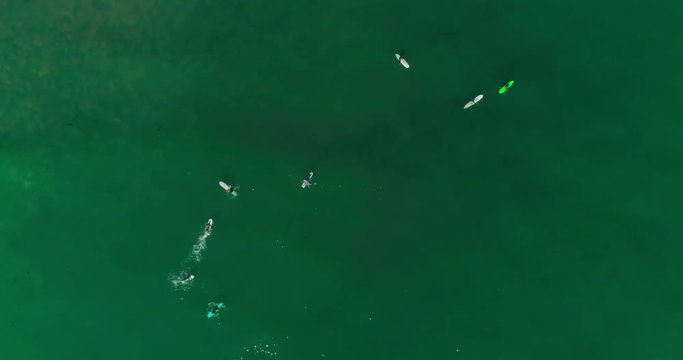Aerial footage of people who are surfing. Surfers, students. Malibu Beach. California. May 2018. 4K slow motion video. Drone. View from the top.