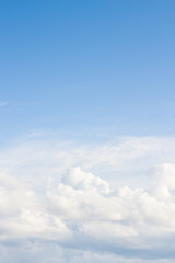 Large white Cumulus clouds on blue sky