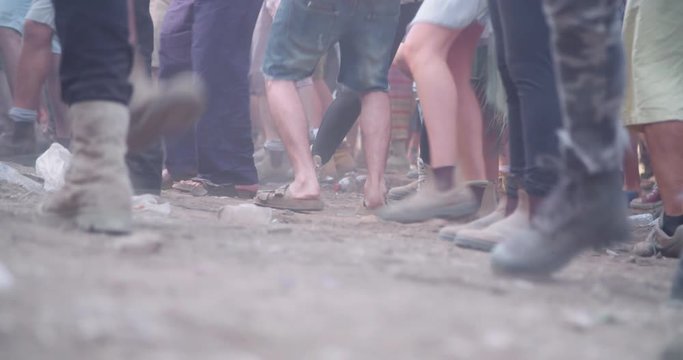 feet of people dancing in a nature trance party