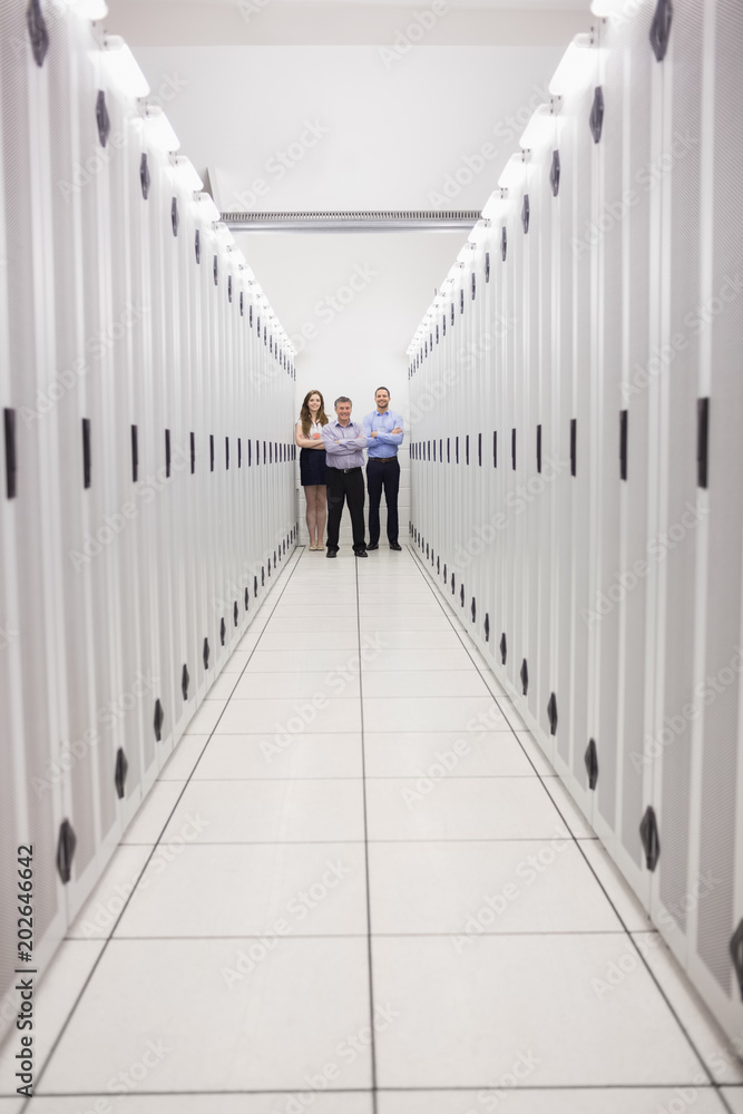 Poster technicians standing at end of server corridor