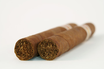 Two Cuban cigars ready to smoke