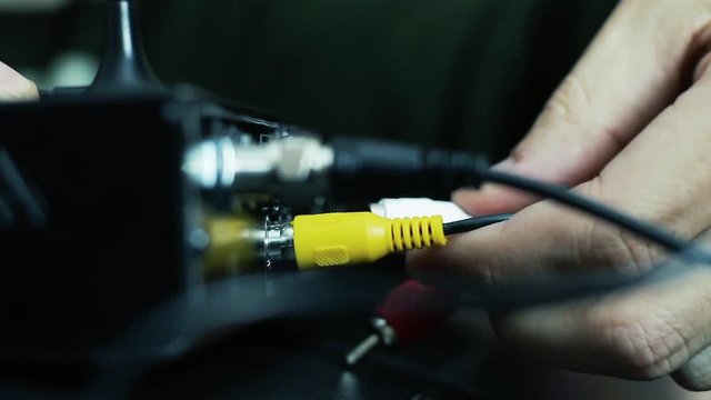 Man Setting Up TV Receiver Device at Home - Close Up 