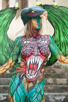 Beautiful woman with fully painted body. Body painting technique..