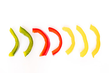 Slices of bell pepper isolated on white background.