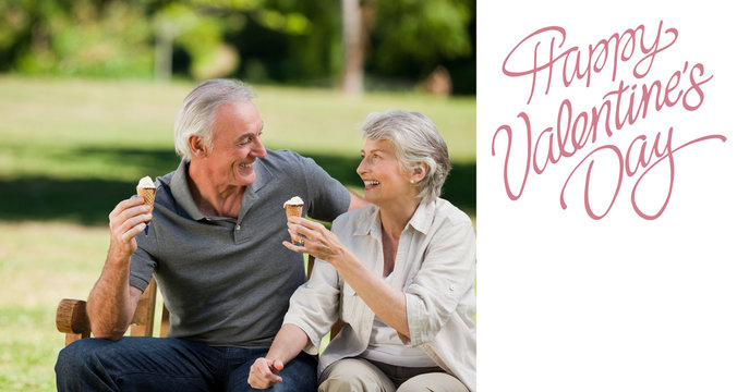 Senior couple eating an ice cream on a bench against cute valentines message