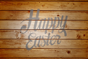 Happy easter against wooden planks background