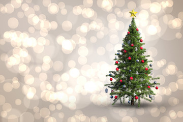Christmas tree on white background against light glowing dots design pattern