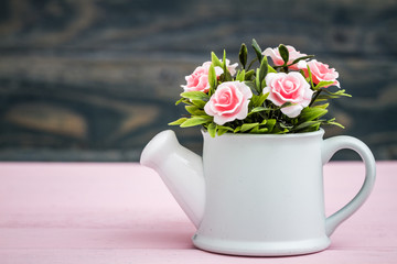 Artificial Colorful Flowers in Decorative Flowerpots on Wooden Background