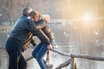 Couple resting in the Park at sunset. Vintage