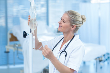 Nurse connecting an intravenous drip