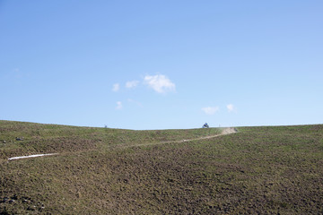 Fototapeta na wymiar motorcyclist likes to run on the ridges of the hills