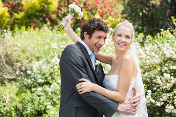 Romantic happy newlyweds hugging each other