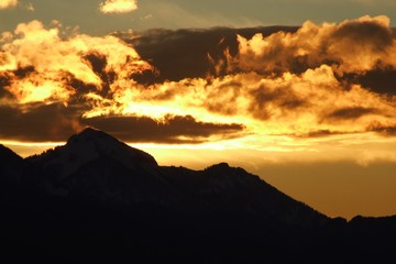 fiery sunset at Chiemgau alps near Siegsdorf with Mt. Hochgern, Bavaria, Germany