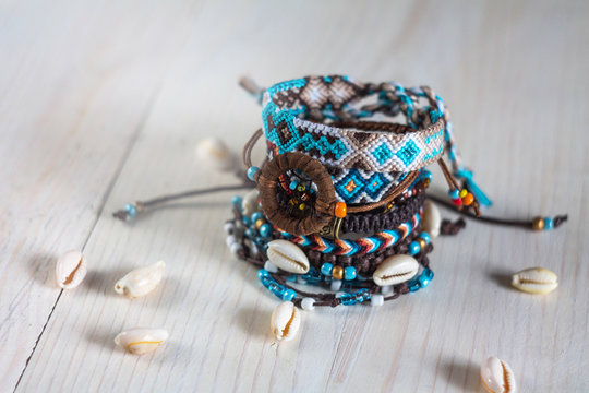 handmade bracelets with beads and cowrie shells from the threads