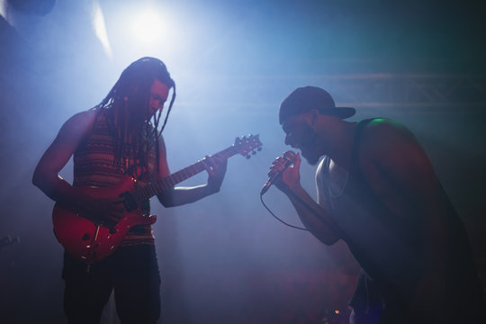 Male musicians performing at nightclub
