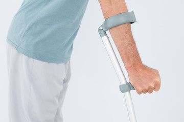 Fototapeta na wymiar Closeup mid section of a man with crutch