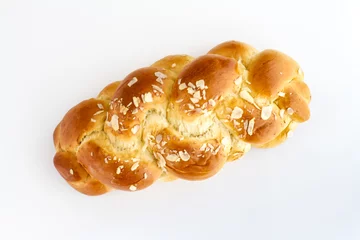 Fotobehang Brioche is a pastry of French origin that is similar to a highly enriched bread, and whose high egg and butter content give it a rich and tender crumb. © Ruslans Golenkovs