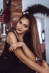 Fototapeta na wymiar Portrait of beautiful young woman with makeup in fashion clothes