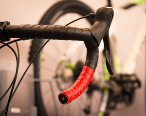 Detail of the red handlebar of a racing bike. - 202666072