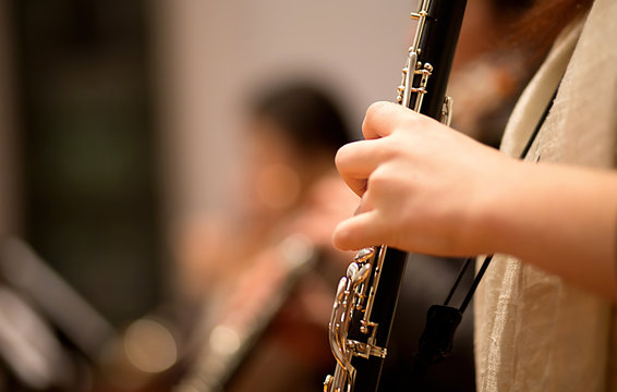 Oboe player performing in a symphony orchestra