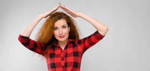 Attractive woman with hands above