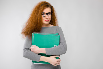 Young woman holding green folder