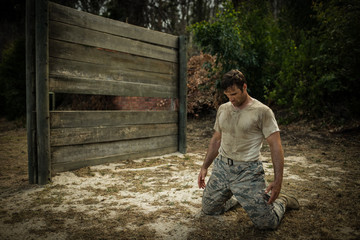 Soldier sitting on his knees